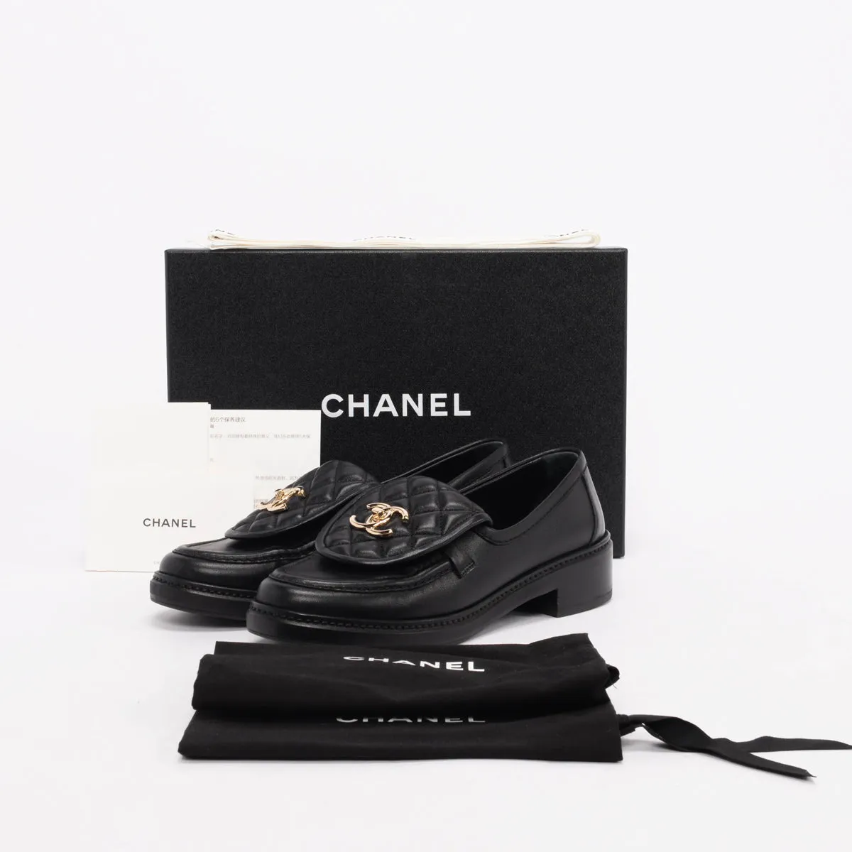 Chanel Black Quilted CC Turnlock Loafers 37.5